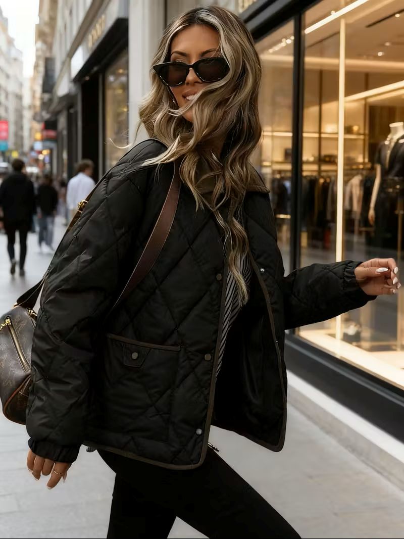 Women’s quilted winter jacket in black – side view, diamond-quilted texture