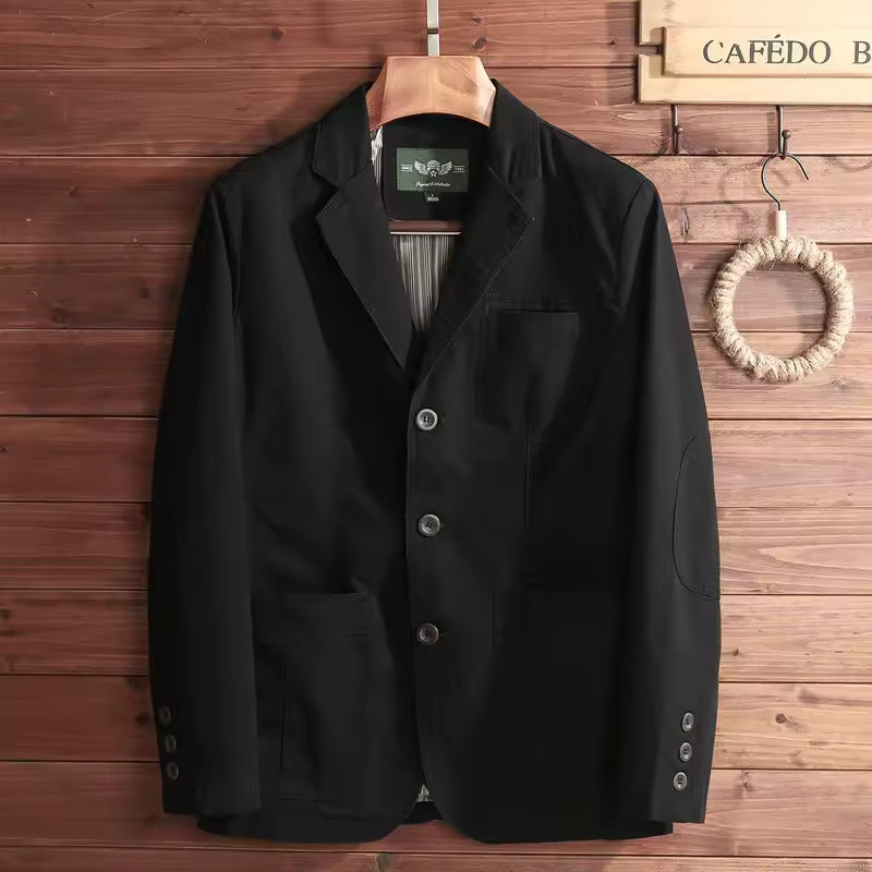 Black jacket on a hanger against a wooden wall with 'CAFE DO' branding.