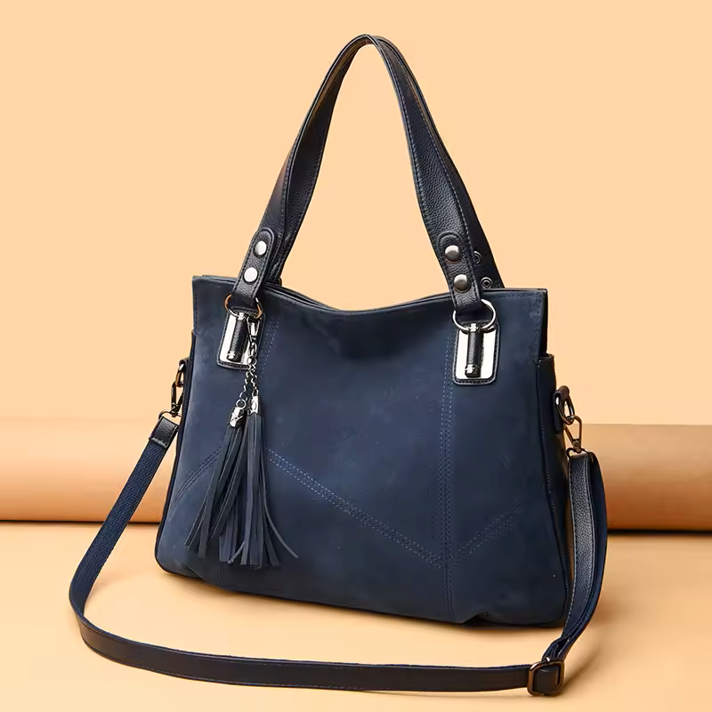 Blue handbag with a strap on a beige background