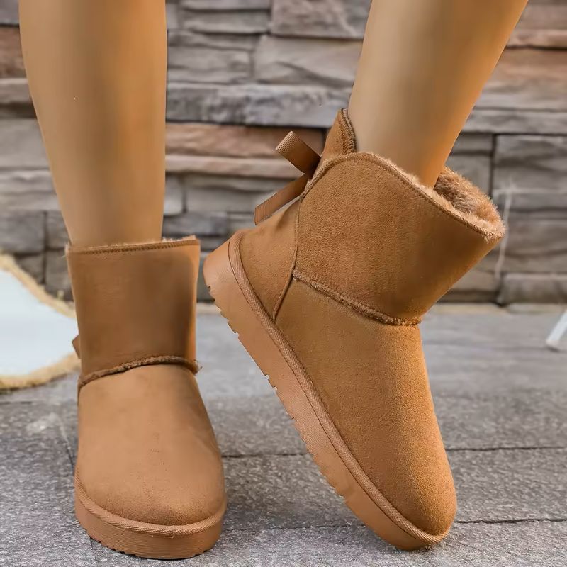 Elara fur-lined winter boots in brown with bow detail