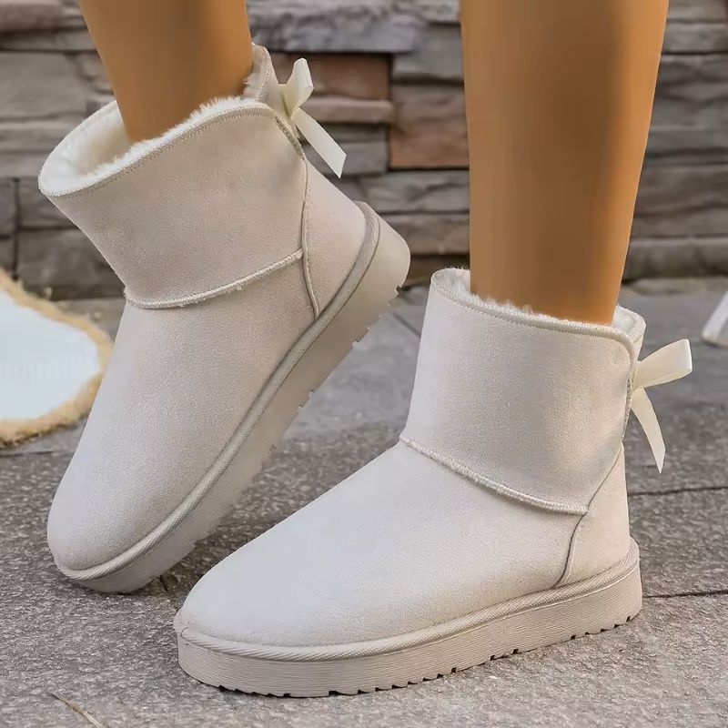 Elara fur-lined winter boots in white with bow 